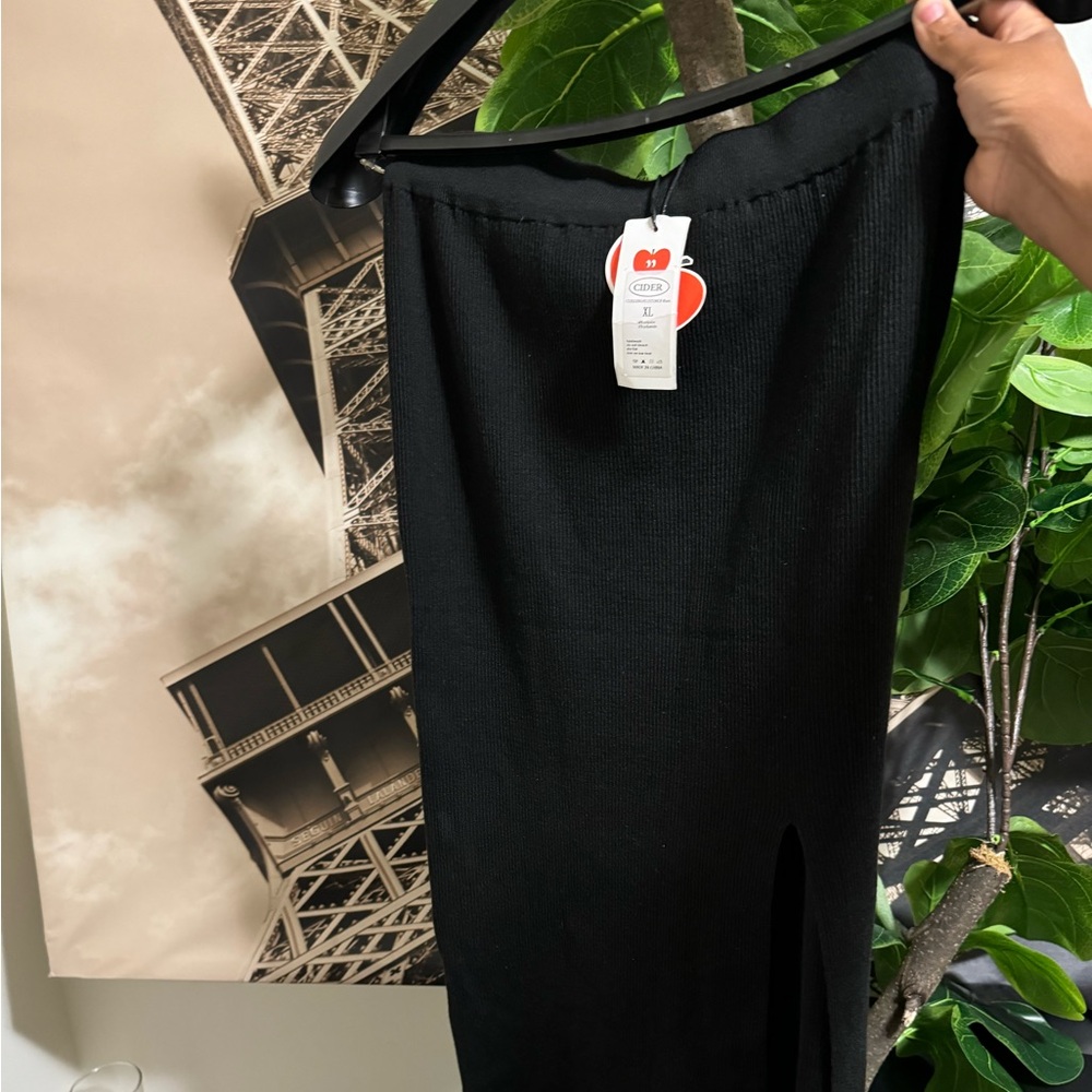 Long black women’s skirt with slit.